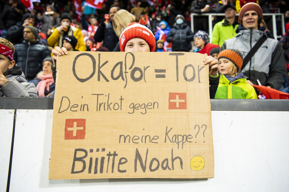 A young boy shows a sign where he asks for the jersey of Switzerland's forward Noah Okafor during the 2022 FIFA World Cup European Qualifying Group C match between Switzerland and Bulgaria at the ...