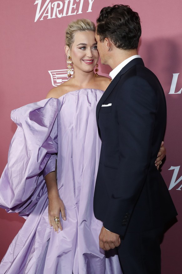 epa09498904 US singer-songwriter Katy Perry (L) and US actor Orlando Bloom (R) attend the Variety&#039;s 2021 Power of Women event at the Wallis Annenberg Center in Beverly Hills, California, USA, 30  ...