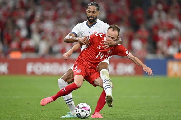 Switzerland&#039;s Gregory Wuethrich, back, and Denmark&#039;s Mikkel Damsgaard during the UEFA Nations League Group D leg 1 soccer match between Denmark and Switzerland, on Thursday, September 5, 202 ...
