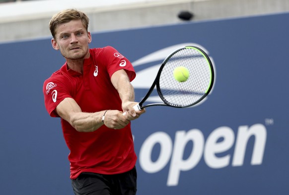 David Goffin, of Belgium, returns a shot to Pablo Carreno Busta, of Spain, during round three of the US Open tennis championships Friday, Aug. 30, 2019, in New York. (AP Photo/Kevin Hagen)