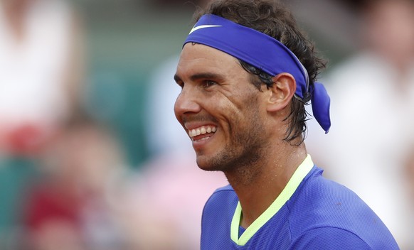 Spain&#039;s Rafael Nadal smiles after defeating Georgia&#039;s Nikoloz Basilashvili during their third round match of the French Open tennis tournament at the Roland Garros stadium, Friday, June 2, 2 ...