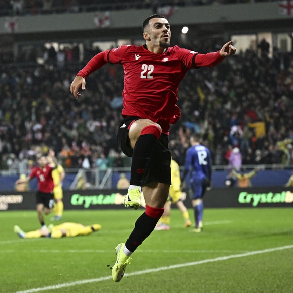 Georgia&#039;s Georges Mikautadze celebrates after scoring his side&#039;s first goal during the UEFA Nations League, group B1 soccer match between Georgia and Ukraine at the AdjaraBet Arena in Batumi ...