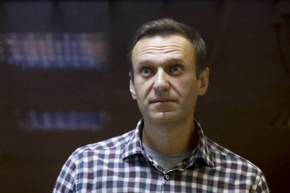 FILE - Russian opposition leader Alexei Navalny stands in a cage in the Babuskinsky District Court in Moscow, Russia on Feb. 20, 2021. The New York-based Train Foundation gave its 2022