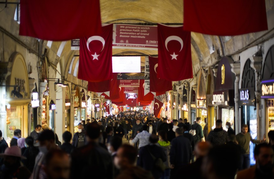 People walk along the Grand Bazaar in Istanbul, Turkey, Tuesday, Nov. 2, 2021. Many Turkish consumers are faced with increased hardship as prices of food and other goods have soared in recent years. T ...