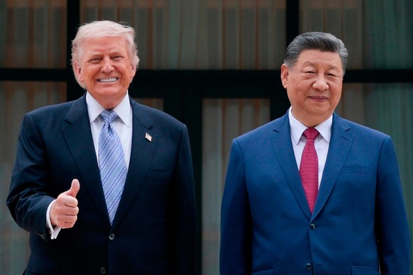 U.S. President Donald Trump, left, poses for a picture with Chinese President Xi Jinping during a visit to the Zhongnanhai Garden in Beijing, Friday, May 15, 2026. (Evan Vucci/Pool Photo via AP)
China ...