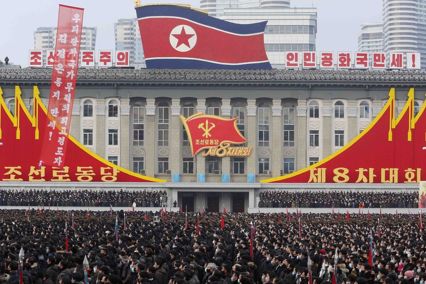 In a mass rally the Pyongyang city army-people celebrate the election of Kim Jong Un as General Secretary of the WPK (Workers&#039; Party of Korea), overlooked by inspirational national symbols at Kim ...