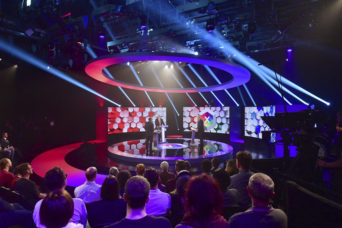 Opposition Labour Party leader Jeremy Corbyn, centre, and Britain's Prime Minister Boris Johnson, right, during a head to head live Election Debate at the BBC TV studios in Maidstone, England, Fr ...