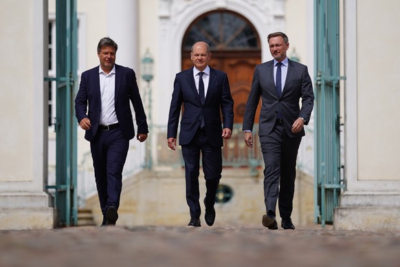 epa09926024 (L-R) German Minister for Economy and Climate Robert Habeck, German Chancellor Olaf Scholz and German Finance Minister Christian Lindner arrive for a press conference after a closed meetin ...