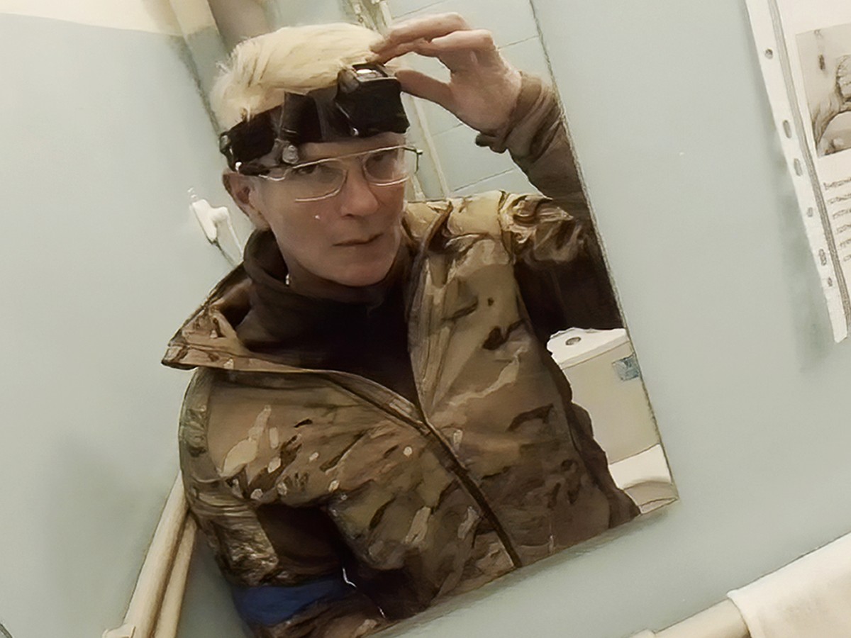 Yuliia Paievska, known as Taira, looks in the mirror and turns off her camera in Mariupol, Ukraine on Feb. 27, 2022. Using a body camera, she recorded her team's frantic efforts to bring people b ...