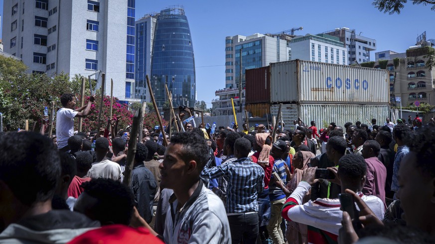 A group of supporters shout slogans at the house of opposition leader Jawar Mohammed to show their support, in Addis Ababa, Ethiopia, Thursday Oct. 24, 2019. EthiopiaÄôs Nobel Peace Prize-winning pri ...