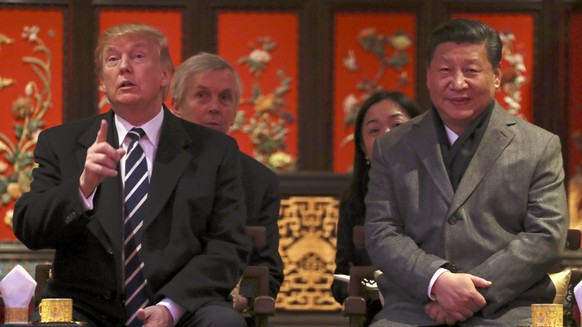 President Donald Trump, left, and Chinese President Xi Jinping, right, arrive for opera performance at the Forbidden City, Wednesday, Nov. 8, 2017, in Beijing, China. Trump is on a five country trip t ...