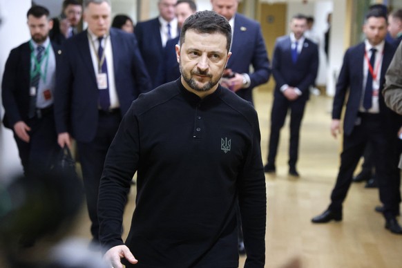 epa11944185 Ukraine&#039;s President Volodymyr Zelensky walks in a EU headquarters corridor after his meeting with France&#039;s president, on the sidelines of the Special European Council to discuss  ...