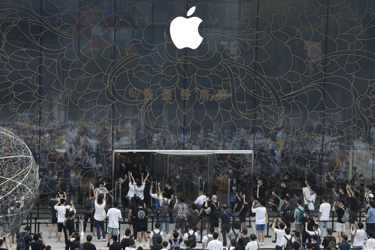Apple fans cheer as the doors to a new flagship store are opened at Sanlitun in Beijing, China on Friday, July 17, 2020. China's economy rebounded from a painful contraction to grow by 3.2% over  ...