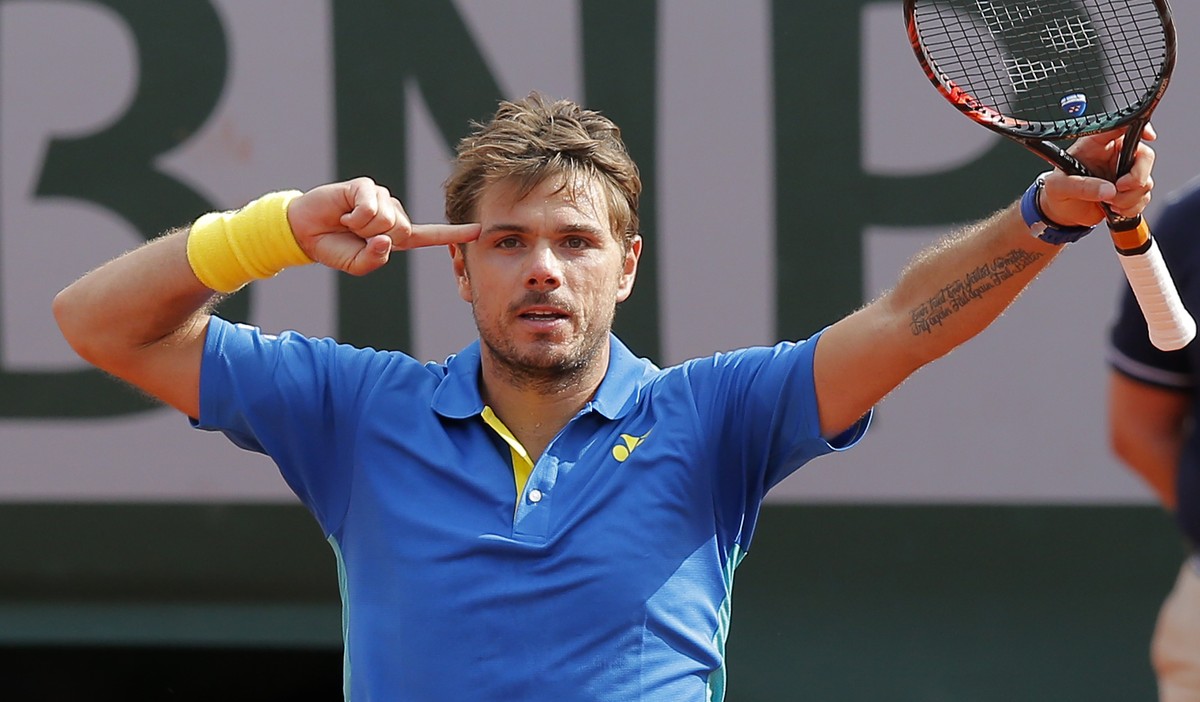 Switzerland's Stan Wawrinka celebrates winning his fourth round match of the French Open tennis tournament against France's Gael Monfils in three sets 7-5, 7-6 (9-7), 6-2, at the Roland Garr ...