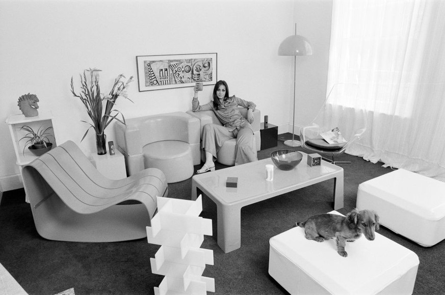 A display of modern furniture, a woman sitting in a modern living room space, 30th June 1969. (Photo by Goodway/Mirrorpix/Getty Images)