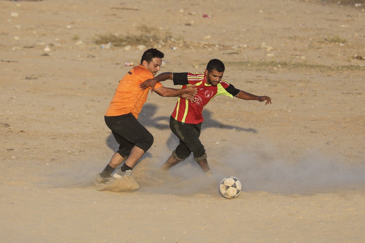 Football tournament in Gaza to lift spirits amid Israeli attacks GAZA CITY, GAZA, PALESTINE - JULY 31: Palestinians take part in the final match of a football tournament organized on the initiative of ...