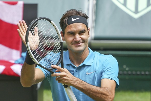 Roger Federer celebrates after he beats Denis Kudla during their semi final match at the Gerry Weber Open ATP tennis tournament in Halle, Germany, Saturday, June 23, 2018. (Friso Gentsch/dpa via AP)