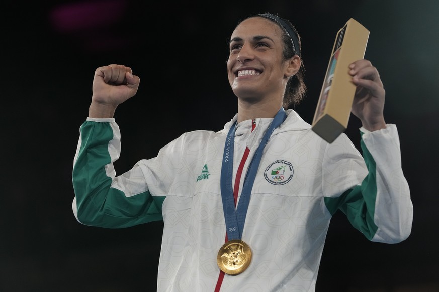 Gold medalist Algeria&#039;s Imane Khelif poses during a medals ceremony for the women&#039;s 66 kg final boxing match at the 2024 Summer Olympics, Friday, Aug. 9, 2024, in Paris, France. (AP Photo/Ar ...