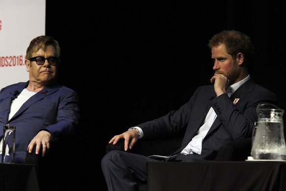 Britain&#039;s Prince Harry, right, shares the stage with British musician Elton John, left, at the 2016 International World AIDS Conference in Durban, South Africa, Thursday July 21, 2016. (AP Photo)