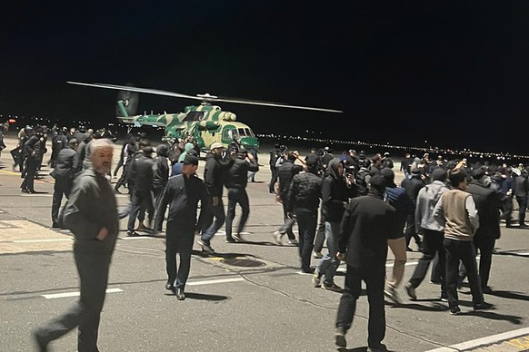 People in the crowd shout anti-Semitic slogans at an airport near the airport in Makhachkala, Russia, on Monday, October 8.  January 30, 2023. Russian news agencies and social media say hundreds of people...