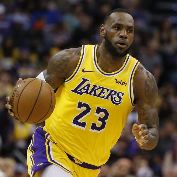 FILE - In this Saturday, March 2, 2019 file photo, Los Angeles Lakers forward LeBron James (23) controls the ball in the second half during an NBA basketball game against the Phoenix Suns in Phoenix. ...