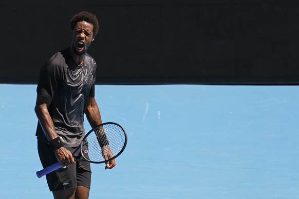 Gael Monfils of France reacts during his third round match against Cristian Garin of Chile at the Australian Open tennis championships in Melbourne, Australia, Friday, Jan. 21, 2022. (AP Photo/Hamish  ...