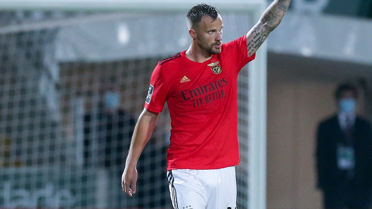 epa09127963 Benfica's Haris Seferovic (L) celebrates after scoring a goal against Pacos de Ferreira during their Portuguese First League soccer match held in Pacos de Ferreira, Portugal, 10 April ...