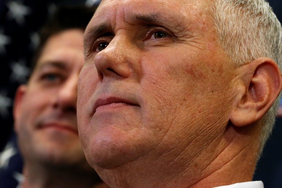 U.S. Vice President-elect Mike Pence (R) joins House Republicans, including Speaker Paul Ryan (R-WI) (L), to speak to reporters after meeting with the Republican House caucus at the U.S. Capitol in Wa ...