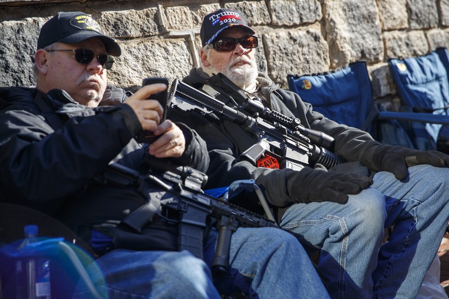 epa08144968 Gun-rights supporters gather for a rally outside the Virginia state capitol in Richmond, Virginia, USA, 20 January 2020. Virginia Citizens Defense League organized the rally to lobby again ...