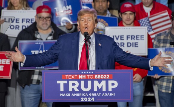epa11033198 Republican candidate for President Former US President Donald Trump, addresses a crowd of supporters during a rally at the University of New Hampshire in Durham, New Hampshire, USA, 16 Dec ...