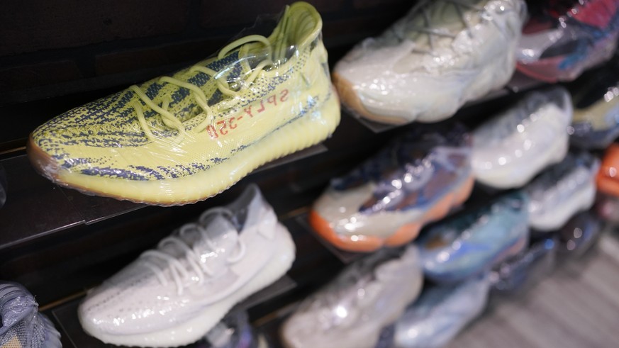 Yeezy shoes made by Adidas are displayed at Kickclusive, a sneaker resale store, in Paramus, N.J., Tuesday, Oct. 25, 2022. Adidas has ended its partnership with the rapper formerly known as Kanye West ...