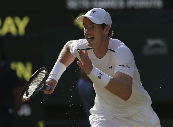 Britain&#039;s Andy Murray runs to make a return to Germany&#039;s Dustin Brown during their Men&#039;s Singles Match on day three at the Wimbledon Tennis Championships in London Wednesday, July 5, 20 ...