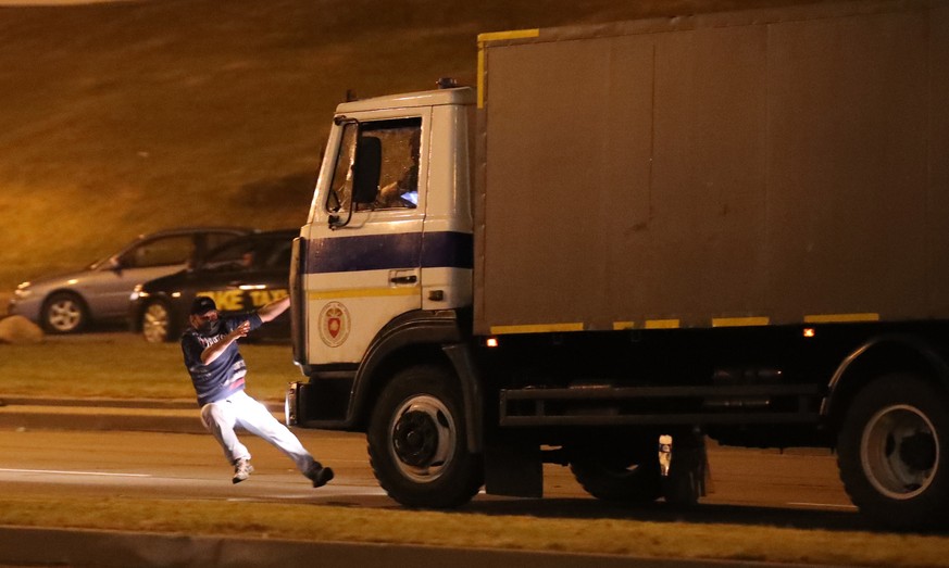 epa08594401 A police truck hits an opposition activist during a protest after polling stations closed at the presidential elections in Minsk, Belarus, 09 August 2020. Five candidates are contesting fo ...
