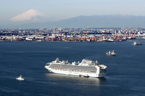 Cruise ship Diamond Princess is anchored off the shore of Yokohama, south of Tokyo, Wednesday, Feb. 5, 2020. Japan said Wednesday 10 people on the cruise ship have tested positive for a new virus and  ...