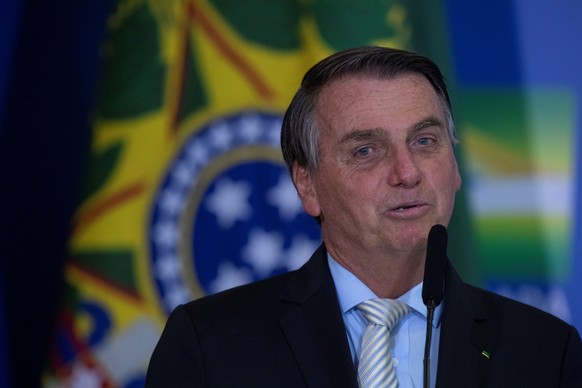 epa09034882 The President of Brazil Jair Bolsonaro during the ceremony of approval of the Central Bank Autonomy Law, in Brasilia, Brazil, 24 February 2021. Brazilian President Jair Bolsonaro renewed h ...