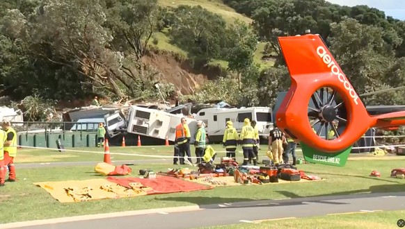 In this image from a video, rescuers and fire crews work near the site of a landslide at the base of Mount Maunganui on New Zealands North Island, Thursday, Jan. 22, 2026. (TVNZ via AP)
New Zealand L ...