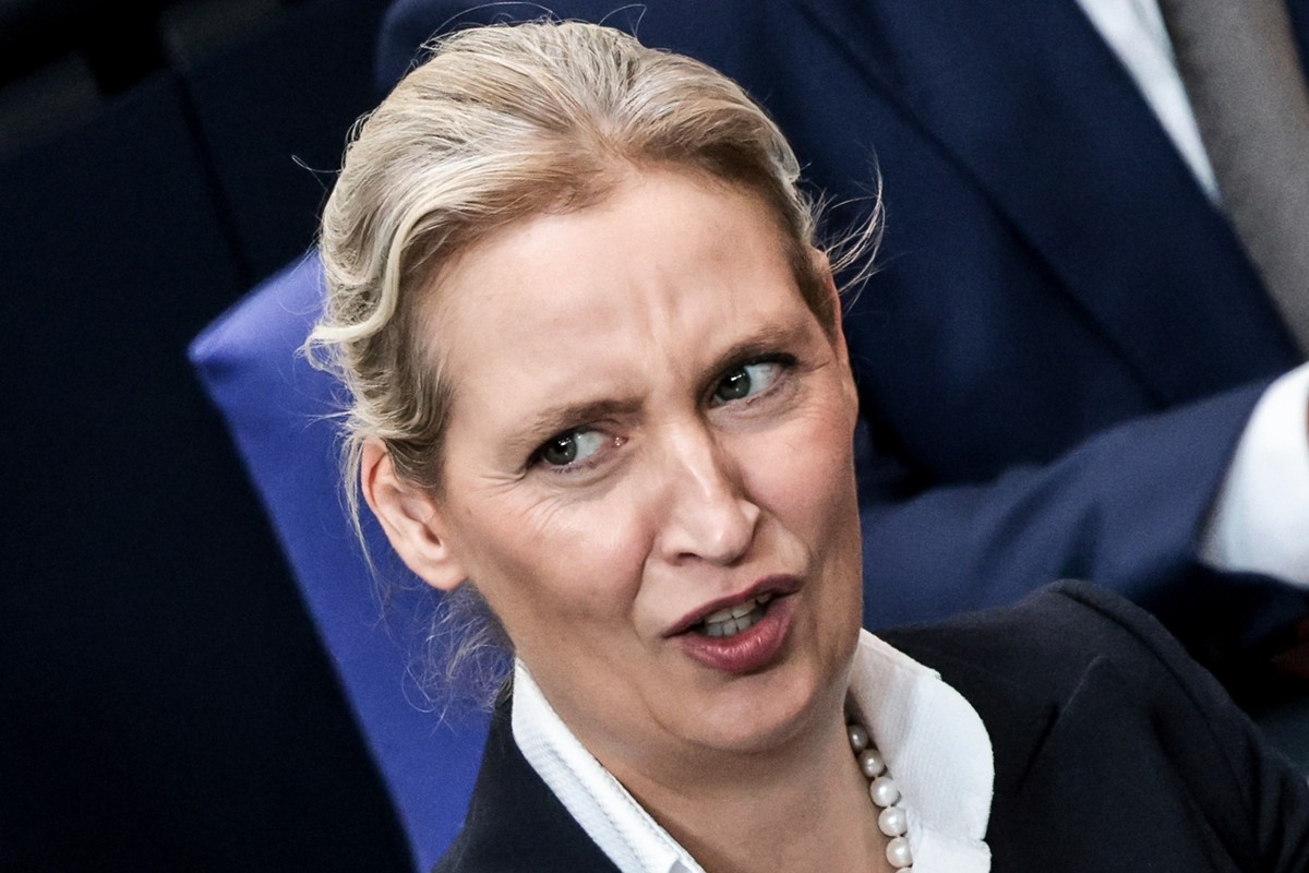 epa13303419 Alternative for Germany (AfD) party and faction co-chairwoman Alice Weidel reacts during a session of the German parliament, the Bundestag, to deliver a government statement in Berlin, Ger ...