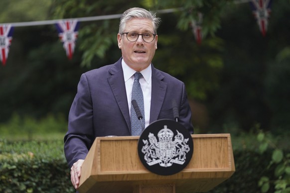 British Prime Minister Sir Keir Starmer speaks as he hosts a VJ Day commemorative reception in the garden of 10 Downing Street, London, Thursday, Aug. 14, 2025. (Alberto Pezzali/PA via AP)
Britain VJ  ...