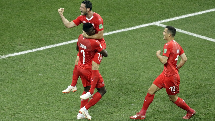 Switzerland&#039;s Blerim Dzemaili, top, celebrates after scoring the opening goal during the group E match between Switzerland and Costa Rica, at the 2018 soccer World Cup in the Nizhny Novgorod Stad ...