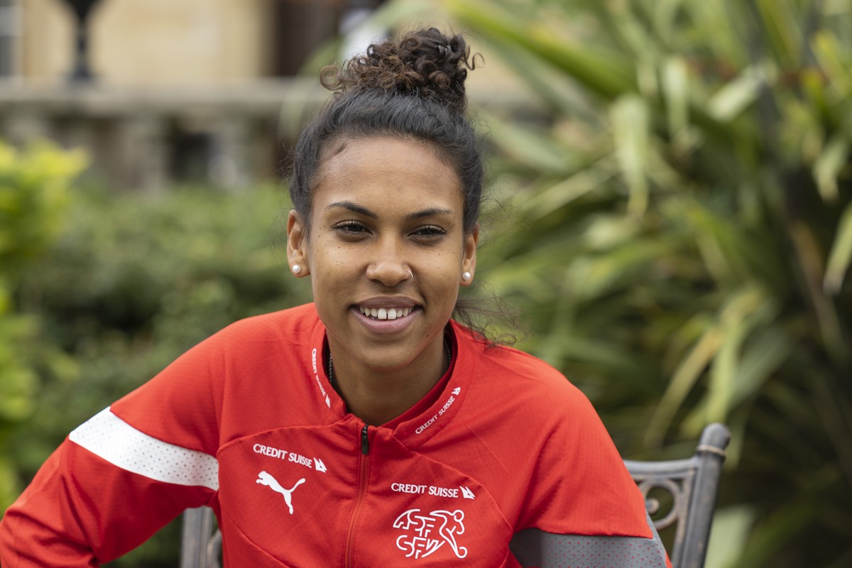 Switzerland's midfielder Coumba Sow talks to the media in the garden of the hotel Oulton Hall during a press conference, at the UEFA Women's Euro England 2022, in Leeds, England, Thursday, J ...