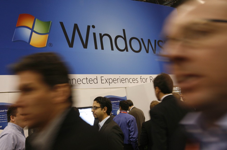 FILE - In this Jan. 11, 2010 file photo, a display for Microsoft&#039;s Windows 7 is shown at the National Retail Federation&#039;s convention in New York. Users still running Microsoft&#039;s Windows ...