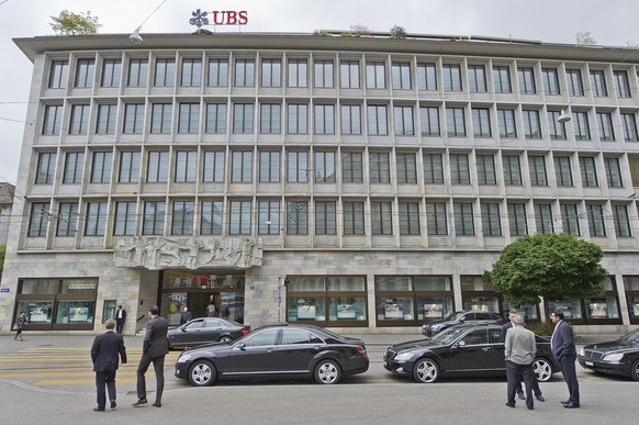 FILE - Cars parked in front of the building of UBS bank in Paradeplatz Square in Zurich, Switzerland, pictured on June 5, 2012. On Tuesday, February 10 2015, UBS reports a 5% rise in the fourth-quarte ...
