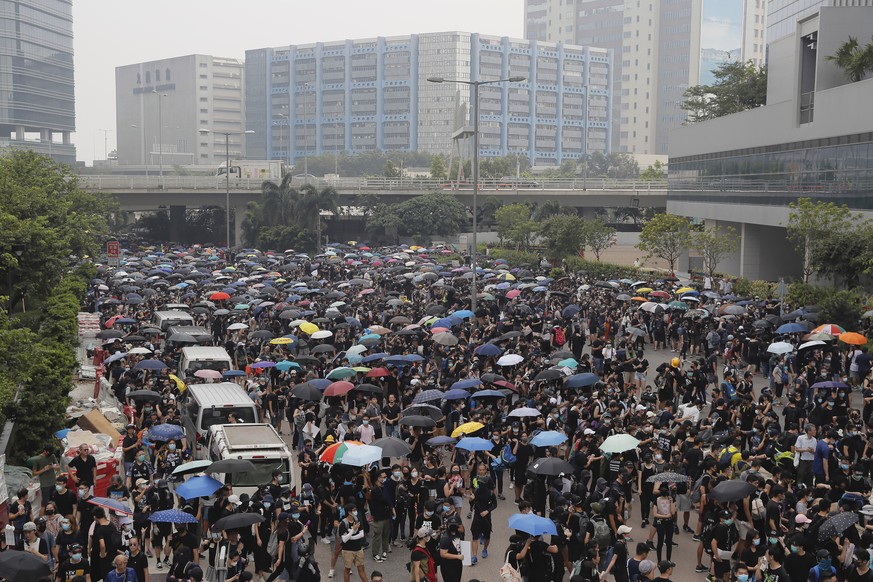 Demonstrators gather on a roadway during a protest in Hong Kong, Saturday, Aug. 24, 2019. Chinese police said Saturday they released an employee at the British Consulate in Hong Kong as the city&#039; ...