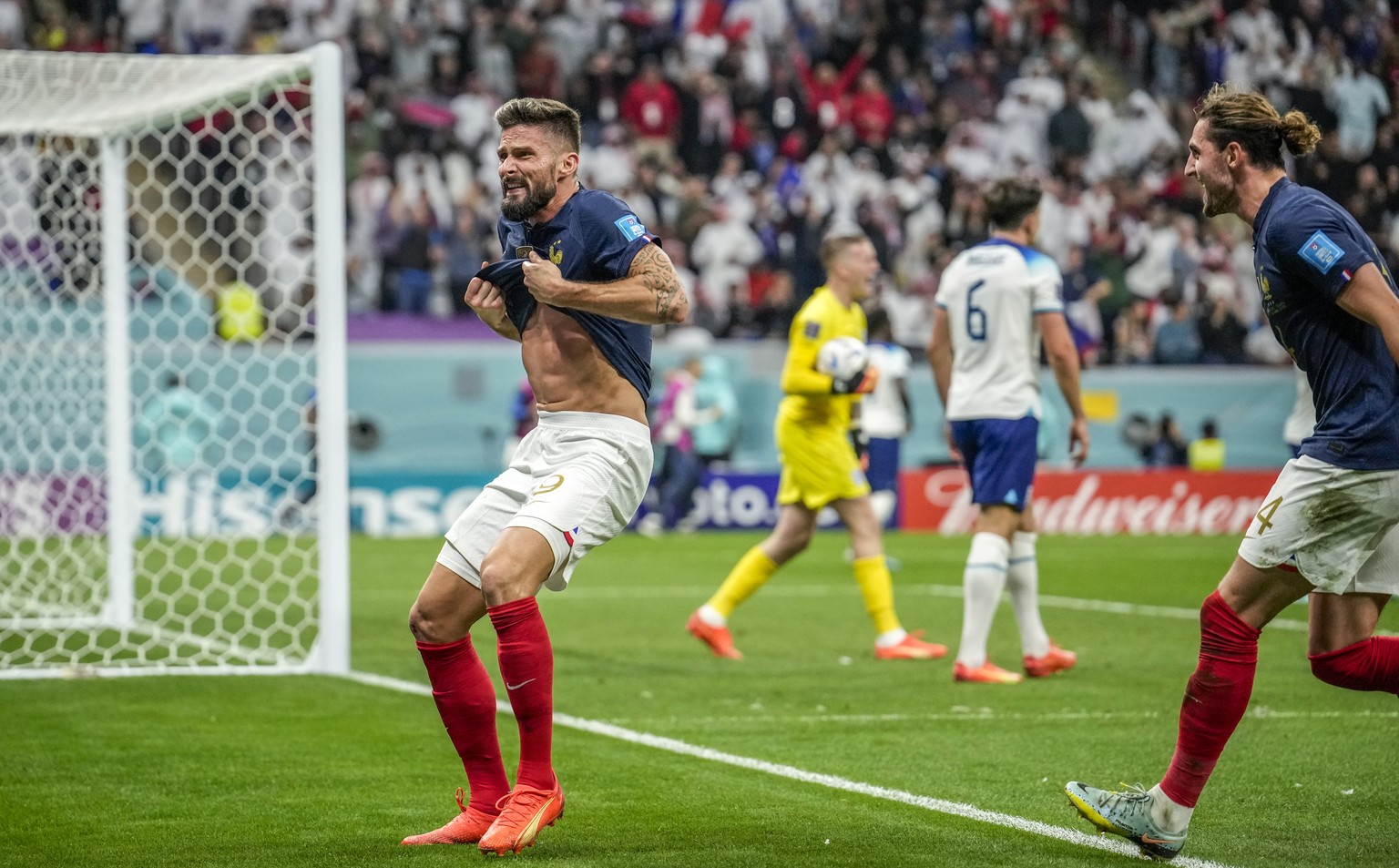 France's Olivier Giroud celebrates after scoring his side's second goal during the World Cup quarterfinal soccer match between England and France, at the Al Bayt Stadium in Al Khor, Qatar, S ...