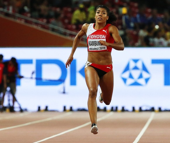 epa04900184 Mujinga Kambundji of Switzerland competes in the women&#039;s 200m semi final during the Beijing 2015 IAAF World Championships at the National Stadium, also known as Bird&#039;s Nest, in B ...