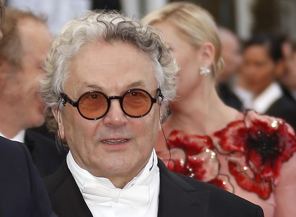 epa05300107 President of the Jury, Australian director George Miller (R) and Danish actor Mads Mikkelsen (L) arrive for the screening of &#039;Cafe Society&#039; and the Opening Ceremony of the 69th a ...