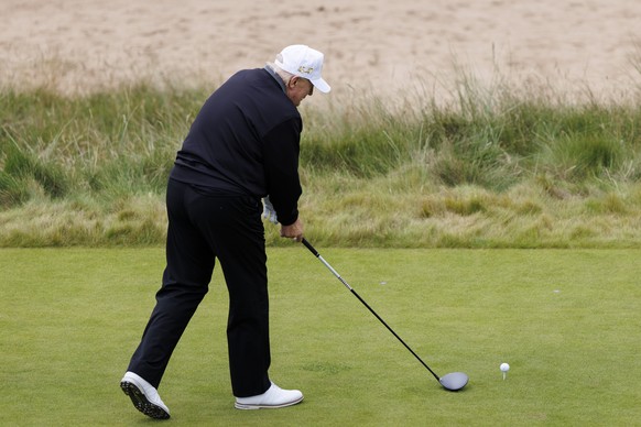 epa12270535 US President Donald J. Trump tees off as he plays golf at the opening ceremony for the Trump International Golf Links in Balmedie, Scotland, Britain, 29 July 2025. This is the final day of ...
