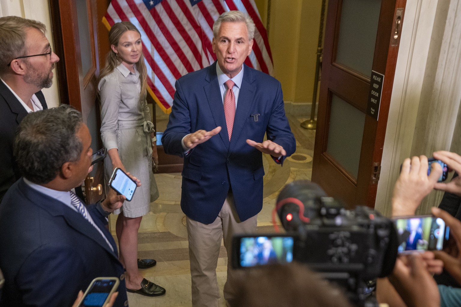 epa10768304 Speaker of the House Kevin McCarthy responds to a question from the news media following a brief statement near the Speakers Balcony in the US Capitol in Washington, DC, USA, 25 July 2023. ...