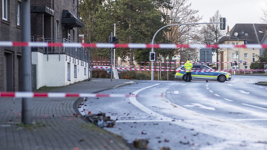 The Police blocks a road in Bottrop, Germany, Tuesday, Jan. 1, 2019. A man has been arrested in Germany after ploughing his car into a crowd of people, injuring at least four, in what appears to have  ...