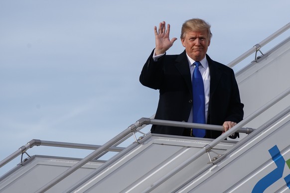 U.S. President Donald Trump alights from Air Force One at Zurich International Airport for the Davos World Economic Forum, Thursday, Jan. 25, 2018, in Zurich, Switzerland. Trump is attending the annua ...
